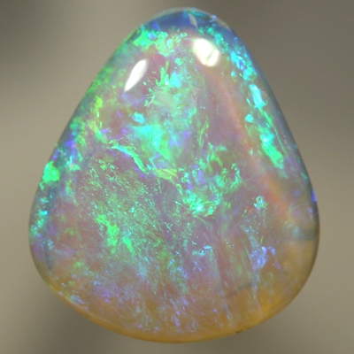 SOLID CRYSTAL OPAL Beautiful green and blues sparkle in a 3D pattern with a hue of purple through out